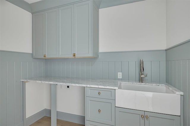 laundry area featuring hookup for an electric dryer, sink, and cabinets