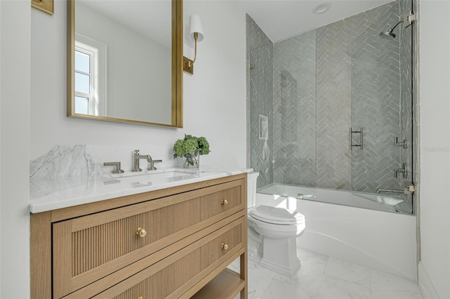 full bathroom featuring vanity, combined bath / shower with glass door, and toilet