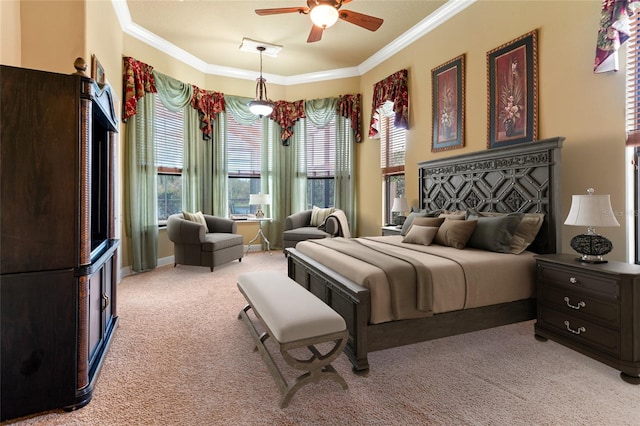 bedroom featuring ornamental molding, light colored carpet, and ceiling fan