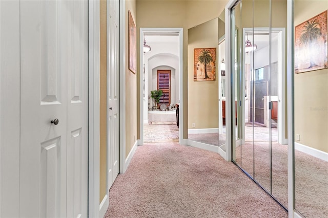 hallway with carpet floors