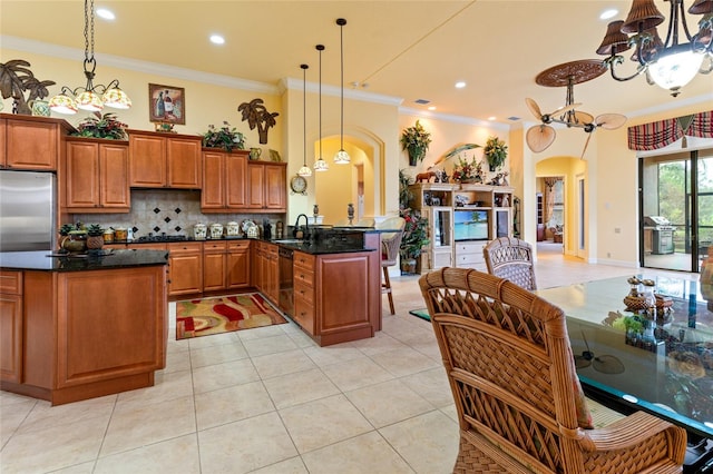 kitchen featuring kitchen peninsula, black dishwasher, a chandelier, crown molding, and sink