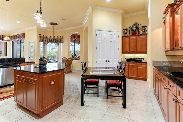 kitchen with ornamental molding, dishwasher, a center island, and hanging light fixtures