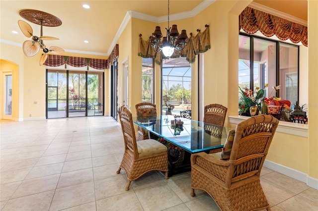 tiled dining space featuring ornamental molding and ceiling fan with notable chandelier