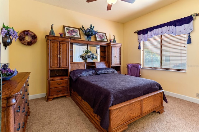 bedroom with light carpet and ceiling fan