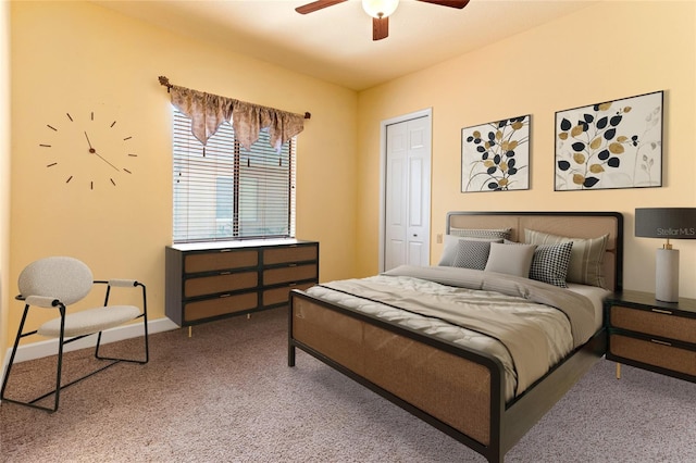 bedroom with a closet, ceiling fan, and carpet floors