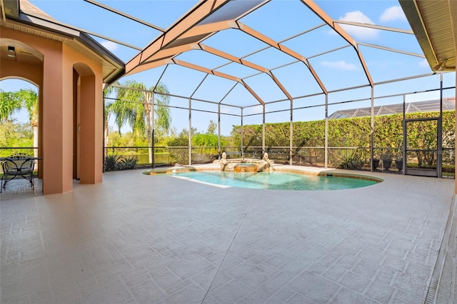 view of swimming pool featuring a patio area, a lanai, and an in ground hot tub