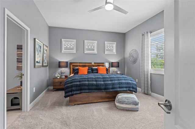 bedroom featuring light carpet and ceiling fan