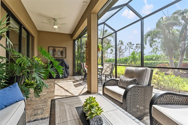 sunroom / solarium with ceiling fan