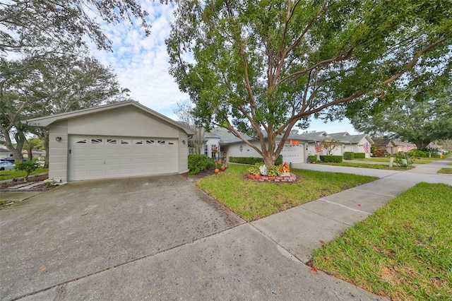 single story home featuring a front yard and a garage