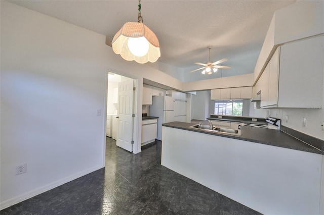 kitchen with pendant lighting, white cabinets, sink, ceiling fan, and kitchen peninsula