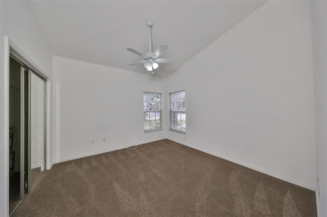 interior space featuring ceiling fan and lofted ceiling