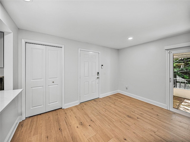 foyer entrance with light wood-type flooring