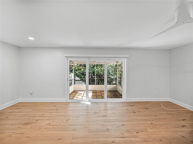 spare room with light hardwood / wood-style flooring