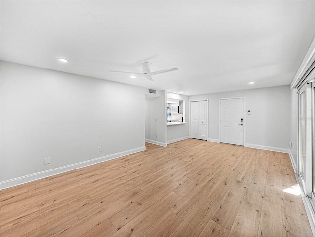 unfurnished living room with light wood-type flooring and ceiling fan