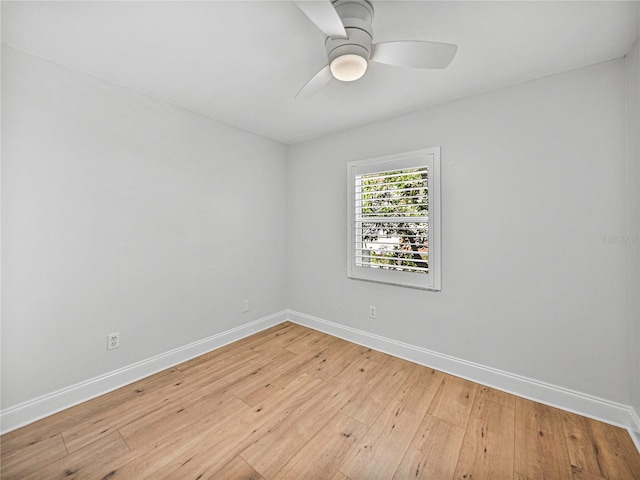 spare room with light hardwood / wood-style flooring and ceiling fan