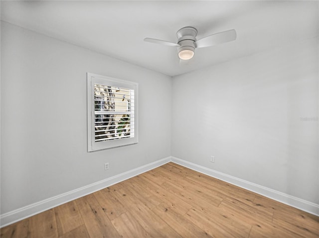 unfurnished room featuring hardwood / wood-style flooring and ceiling fan