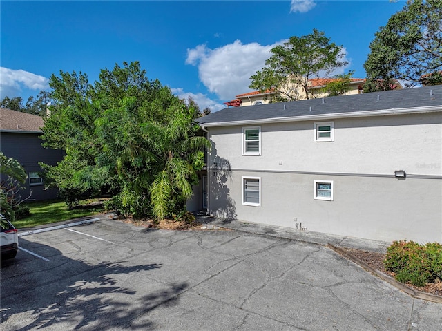 view of side of property with a patio area