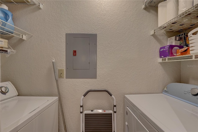 laundry room with washer and dryer and electric panel