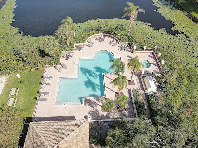 birds eye view of property with a water view