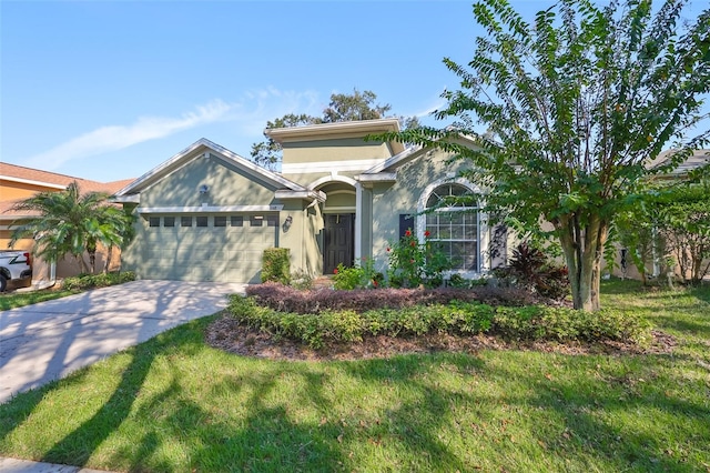 view of front facade featuring a front yard and a garage