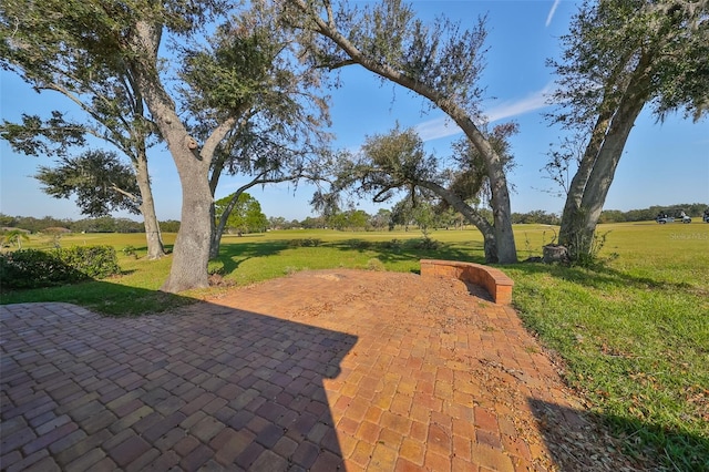 view of patio / terrace with a rural view