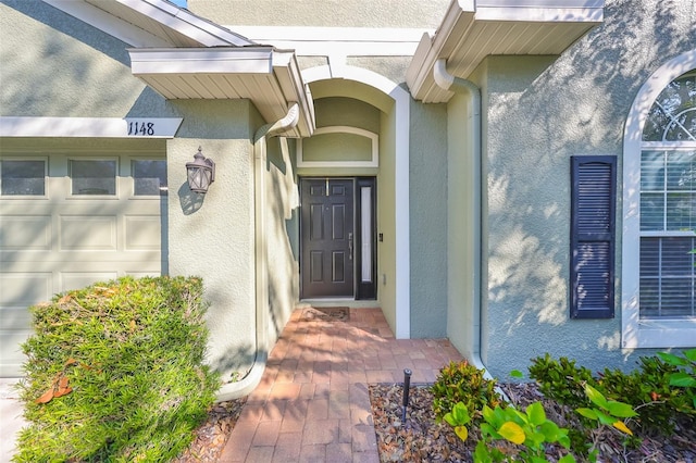 entrance to property featuring a garage