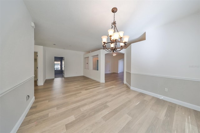 interior space with light hardwood / wood-style flooring and a chandelier