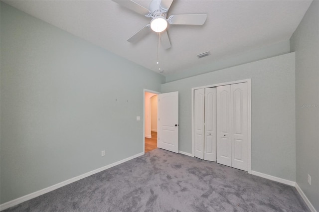 unfurnished bedroom with a closet, ceiling fan, and light colored carpet