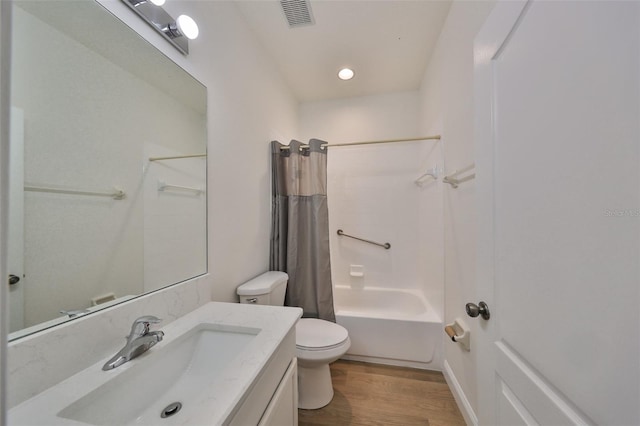 full bathroom with toilet, hardwood / wood-style flooring, shower / bathtub combination with curtain, and vanity