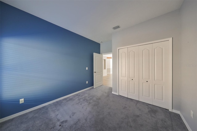 unfurnished bedroom featuring a closet and carpet