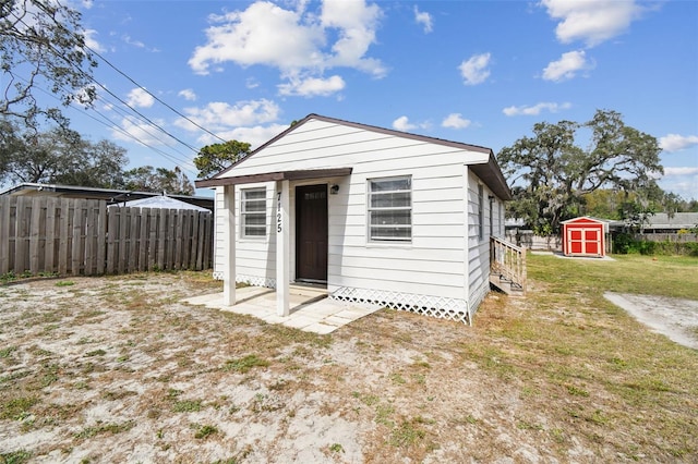 view of outbuilding with a yard