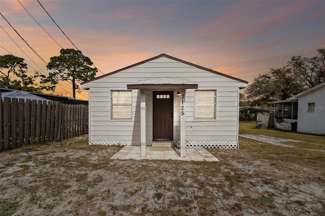 view of front of property with a lawn