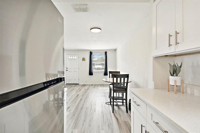 interior space with light hardwood / wood-style flooring