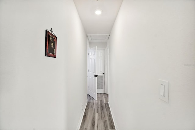 corridor featuring light hardwood / wood-style floors