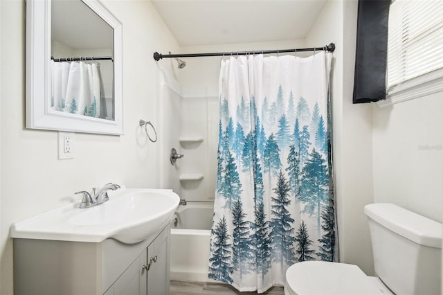 full bathroom featuring vanity, toilet, wood-type flooring, and shower / bath combo