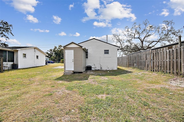 back of property featuring a yard