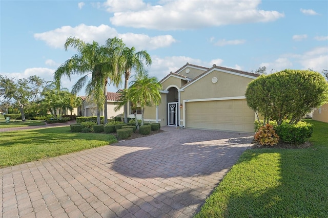 view of front facade with a front yard and a garage