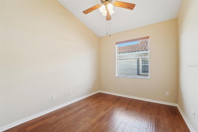 unfurnished room with ceiling fan, hardwood / wood-style flooring, and vaulted ceiling