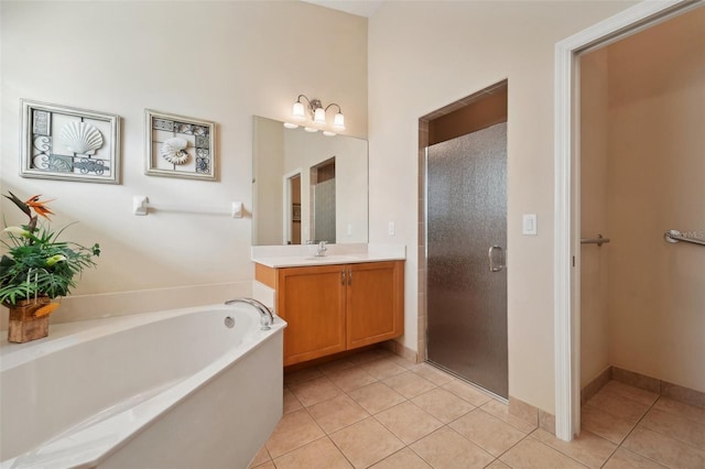 bathroom with vanity, tile patterned floors, and plus walk in shower