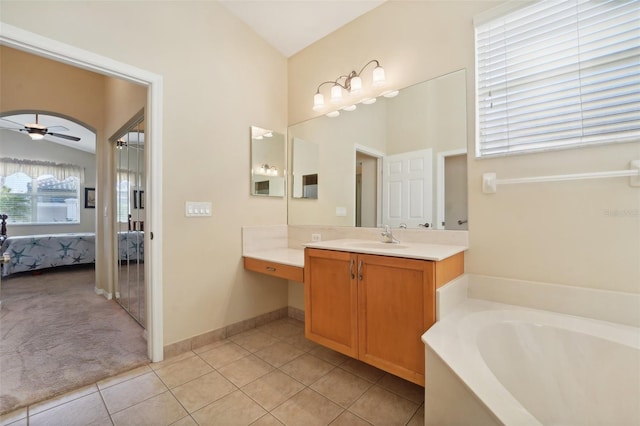 bathroom with vanity, a tub to relax in, tile patterned floors, and ceiling fan