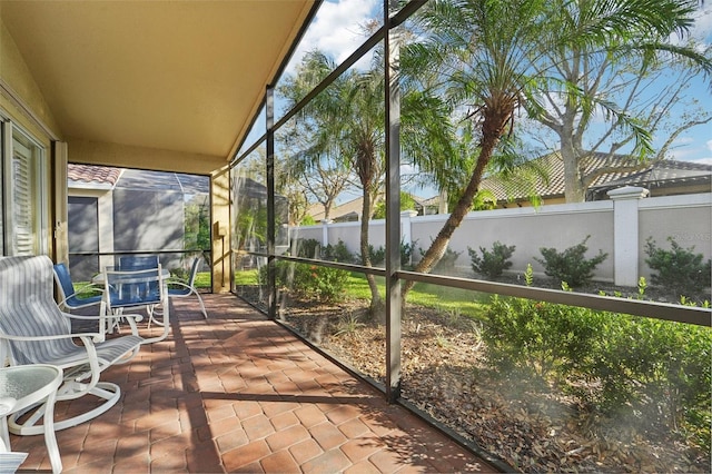 unfurnished sunroom with a wealth of natural light