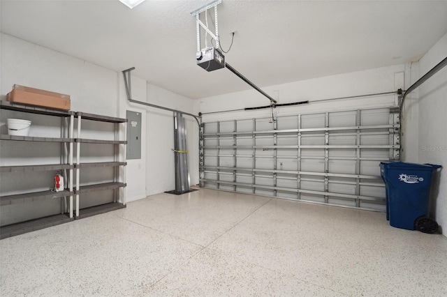 garage featuring electric panel and a garage door opener