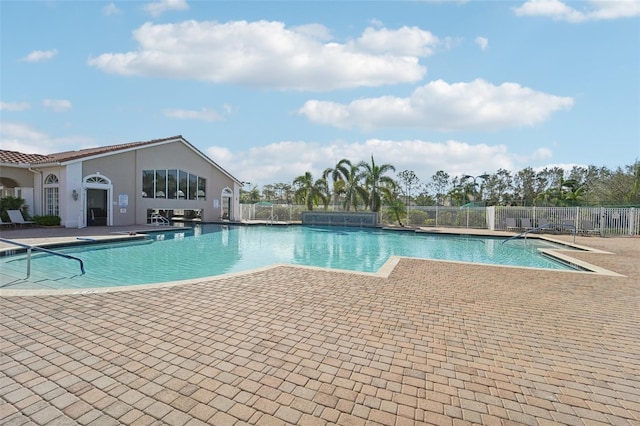 view of swimming pool with a patio area