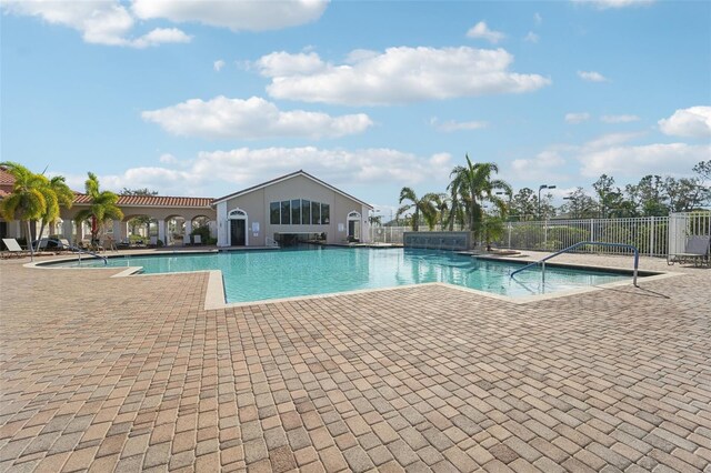 view of swimming pool featuring a patio area