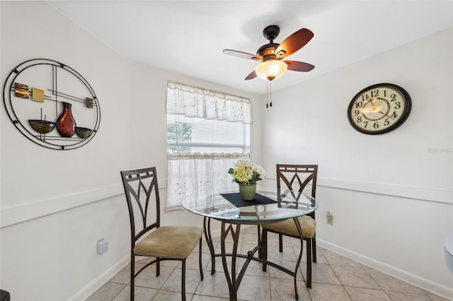 dining room with ceiling fan and light tile patterned flooring