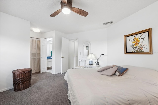 bedroom featuring ceiling fan, connected bathroom, a closet, and carpet floors