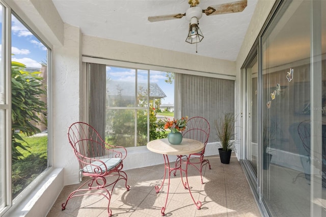 sunroom / solarium with ceiling fan