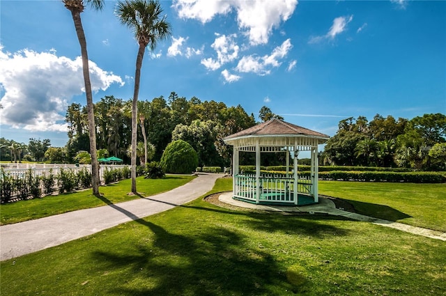 view of home's community with a lawn and a gazebo