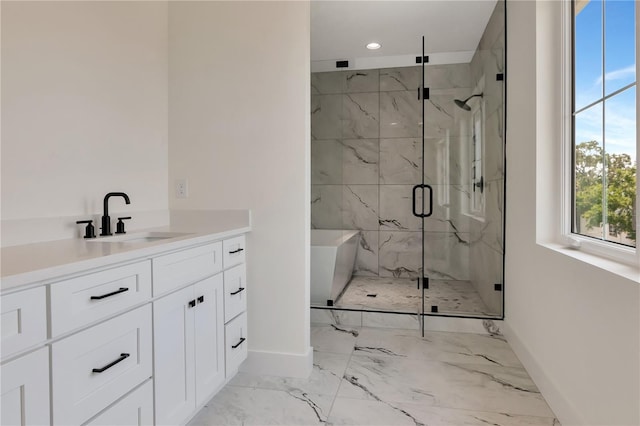 bathroom featuring baseboards, vanity, marble finish floor, a marble finish shower, and recessed lighting