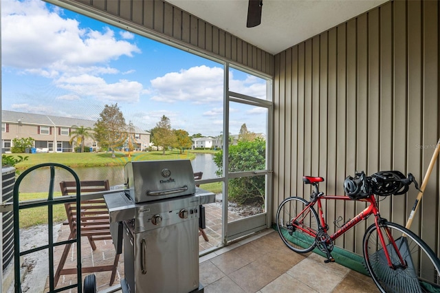 sunroom / solarium with a water view